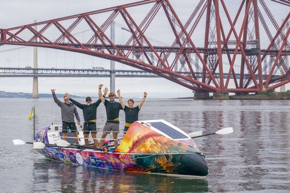 The crew of ROW4MND at the Forth Bridge