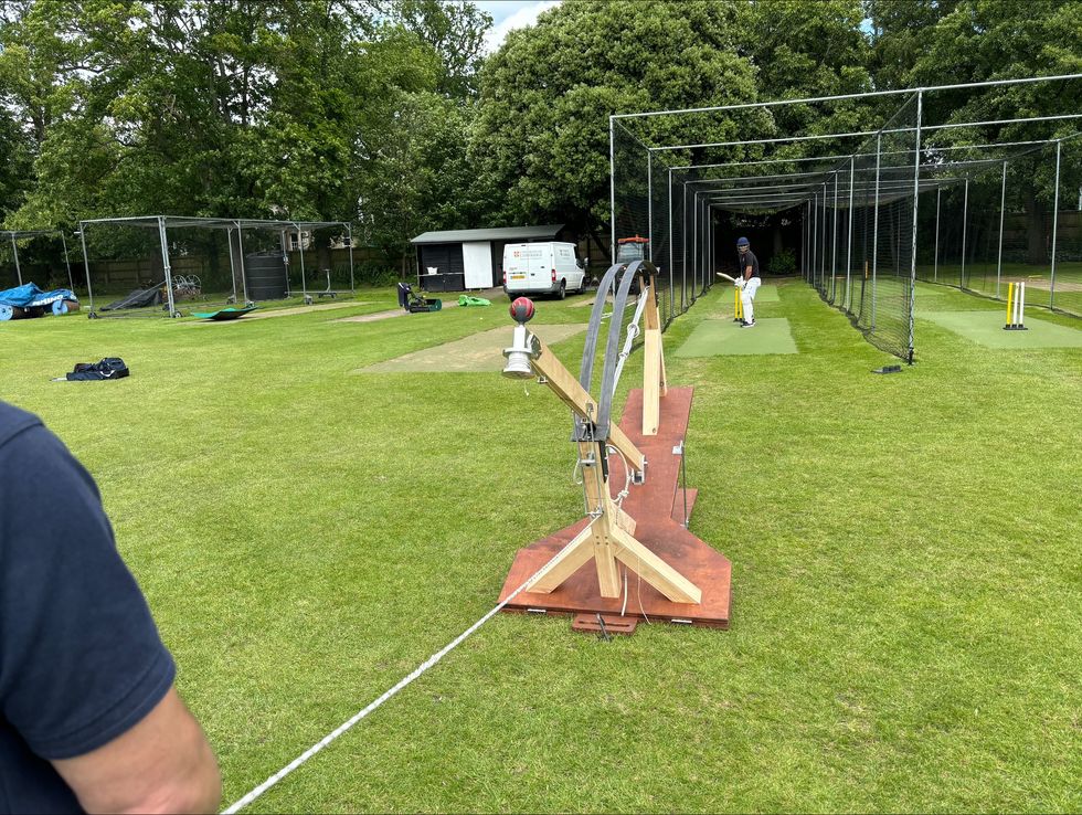 The cricket ball is loaded in the Venn bowling machine. (Sam Russell/ PA)