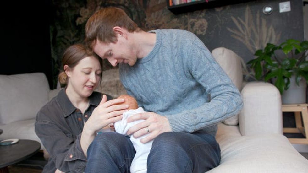 The Davidsons holding their baby