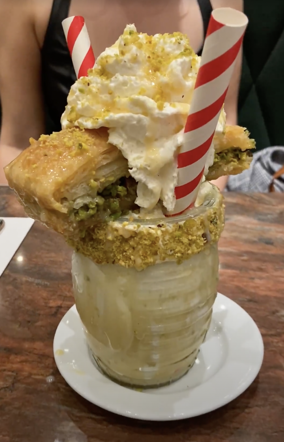 The decadent baklava milkshake, with a giant piece of baklava perched on top