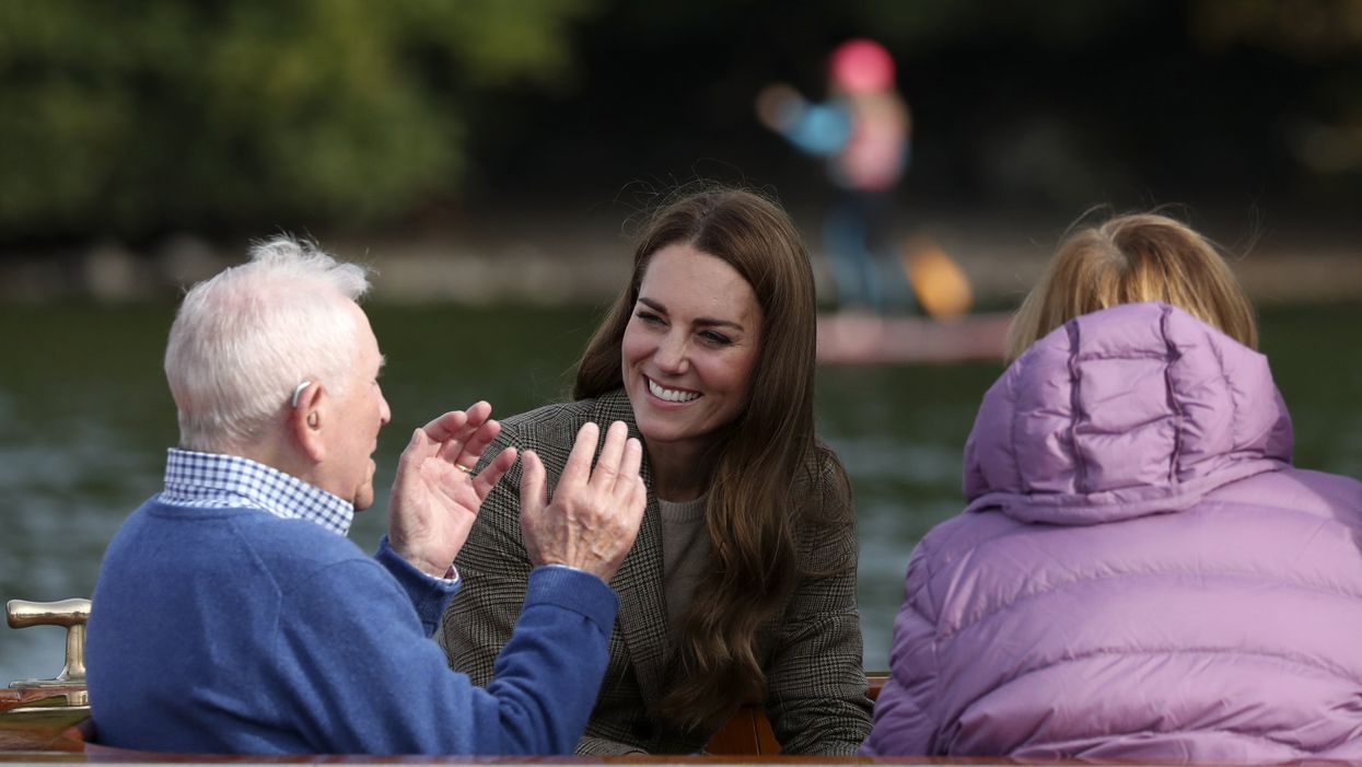 The Duchess of Cambridge (centre) meets Ike Alter and Diane Stoller in the steam launch Osprey (Scott Heppell/PA)