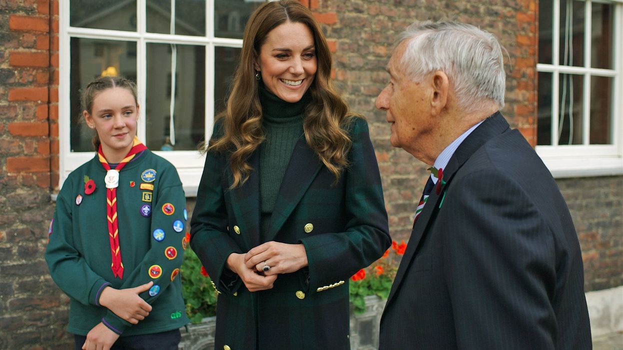The Duchess of Cambridge in conversation with Colonel David Blum OBE,and ten-year old Cub Scout Emily Edge (Kensington Palace/PA)