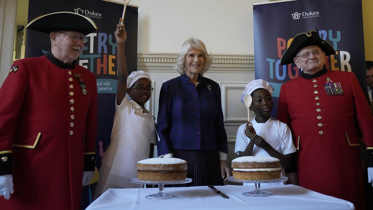 The Duchess of Cornwall, centre, with children and Chelsea Pensioners during the recital (Frank Augstein/PA)