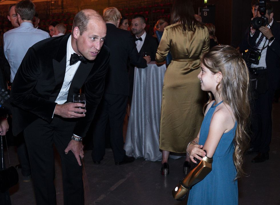 The Duke of Cambridge speaks with Phoebe Sinclair, who has a Disney themed robotic arm (Arthur Edwards/The Sun)