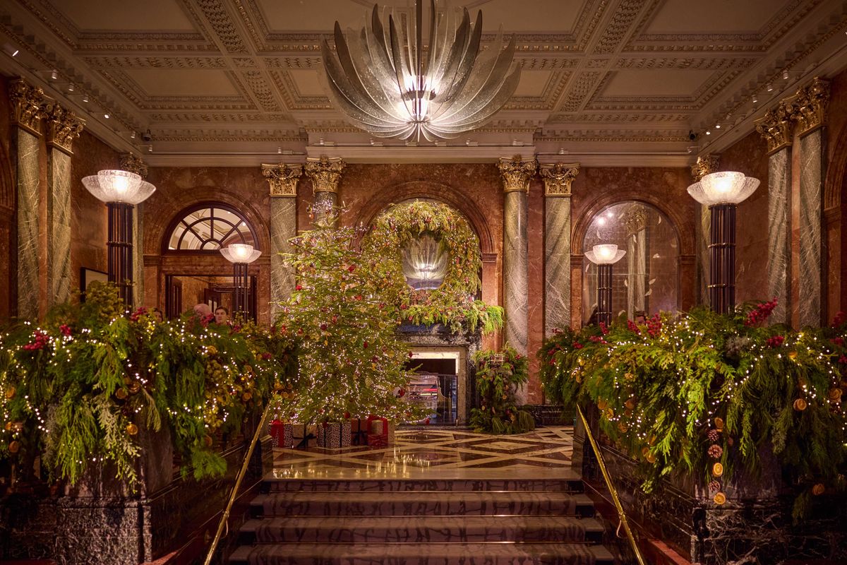 The entrance hall to the Mandarin Oriental in London, covered in festive tree decorations
