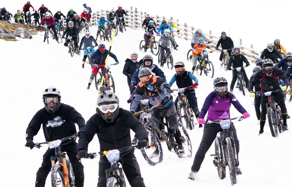 Hundreds of daring mountain bikers in 900m descent of snow-capped mountain