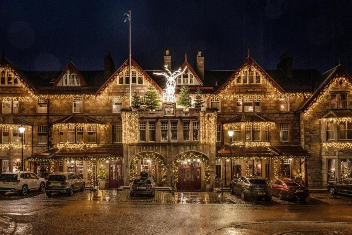 The exterior of The Fife Arms decorated with Christmas lights