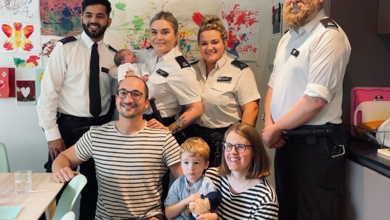 The family and the police officers who delivered the child have been reunited (Metropolitan Police/PA)