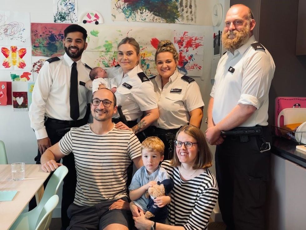 The family and the police officers who delivered the child have been reunited (Metropolitan Police/PA)