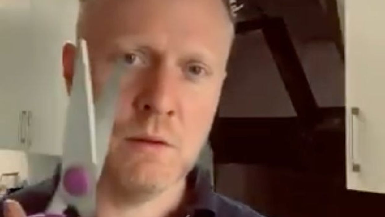 <p>The Financial Times’ Jim Pickard prepares to eat his hat - literally</p>