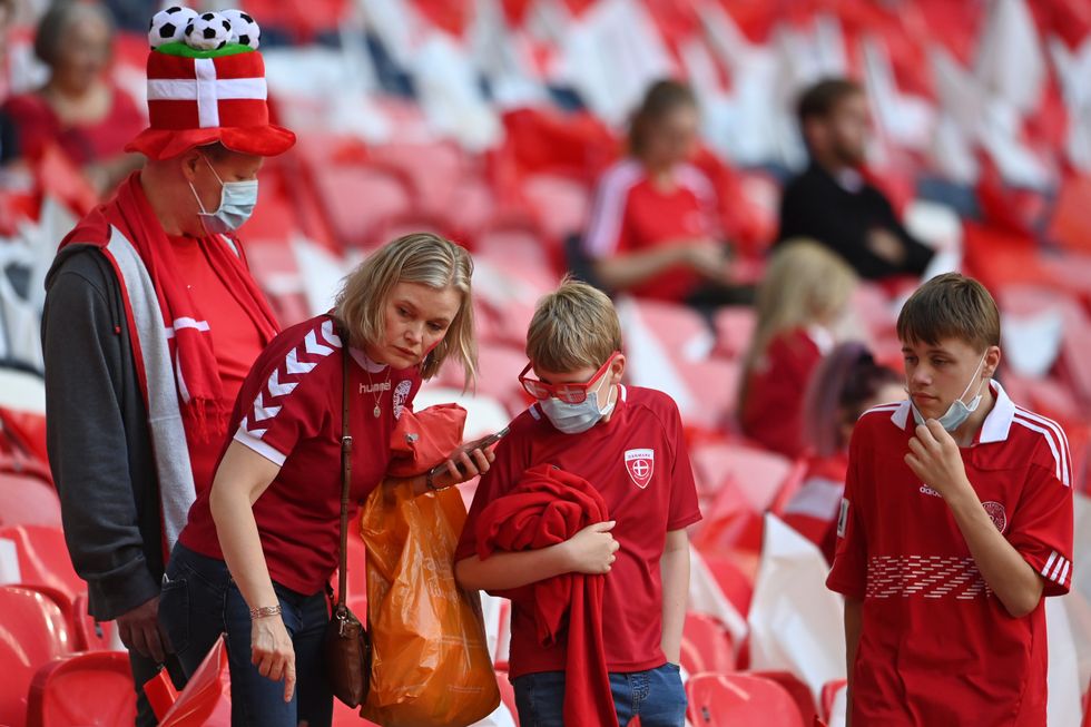 The first few Denmark fans are seen taking their seats at Wembley