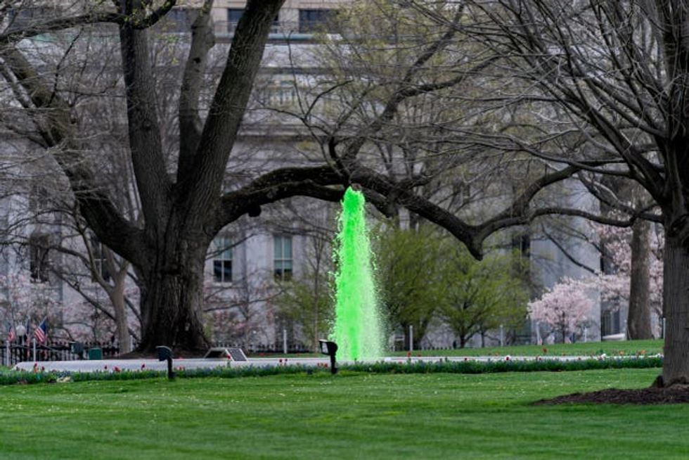 The fountain on the North Lawn of the White House is dyed green for St Patrick\u2019s Day