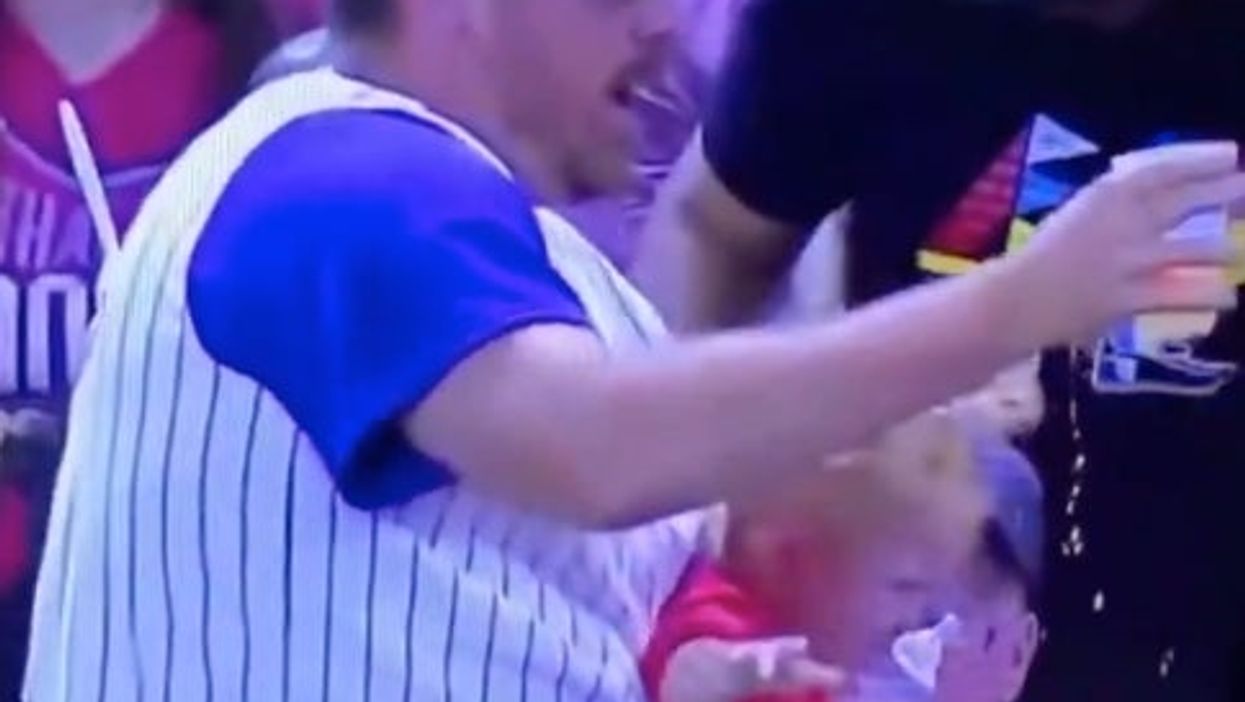 <p>The guy seemed to do a better job of protecting his beer than his child</p>