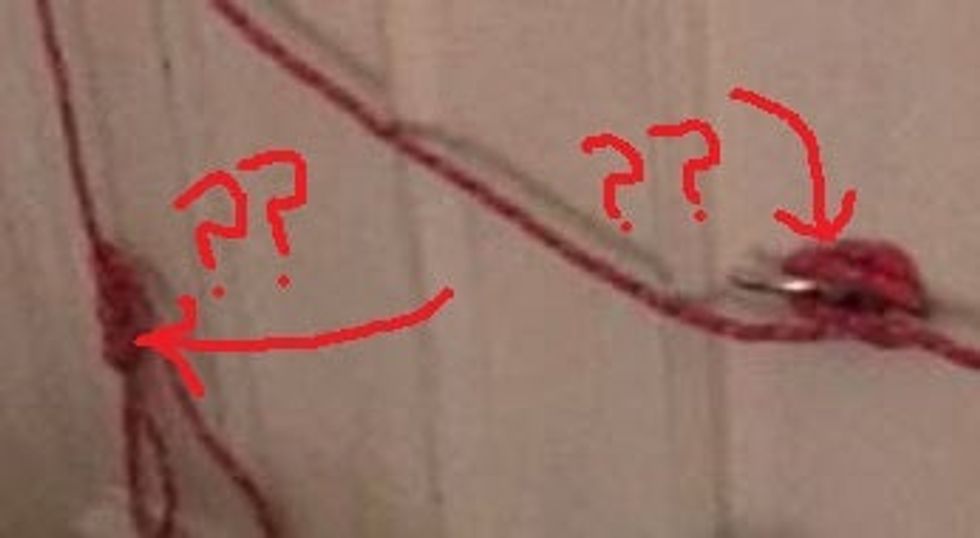 The headboard on Maison's bed, tied with ropes