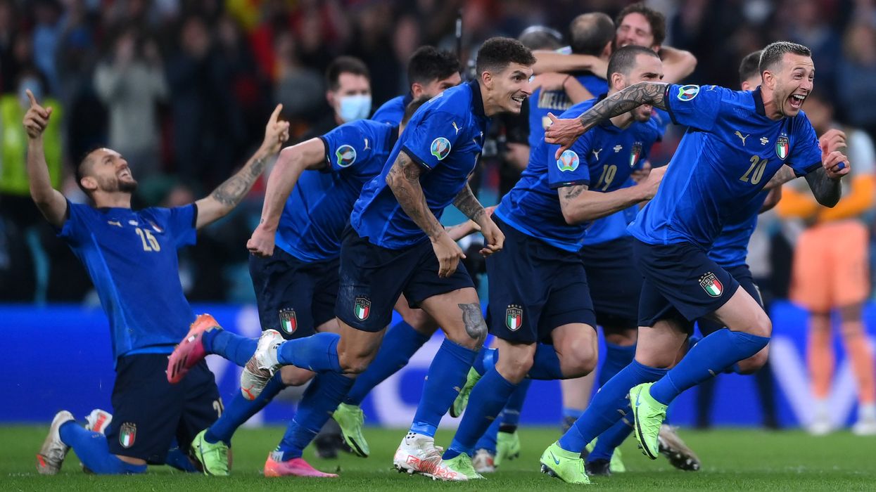 <p>The Italy players celebrate after their penalty shootout victory</p>
