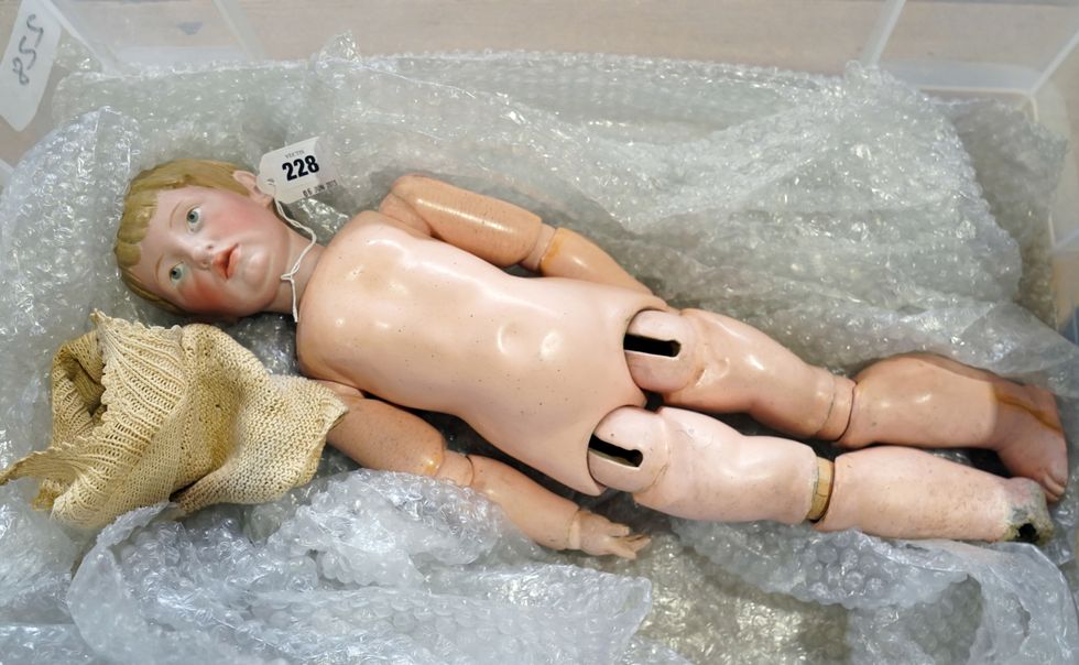 Dog-chewed doll saved from the skip fetches £53,000 at auction