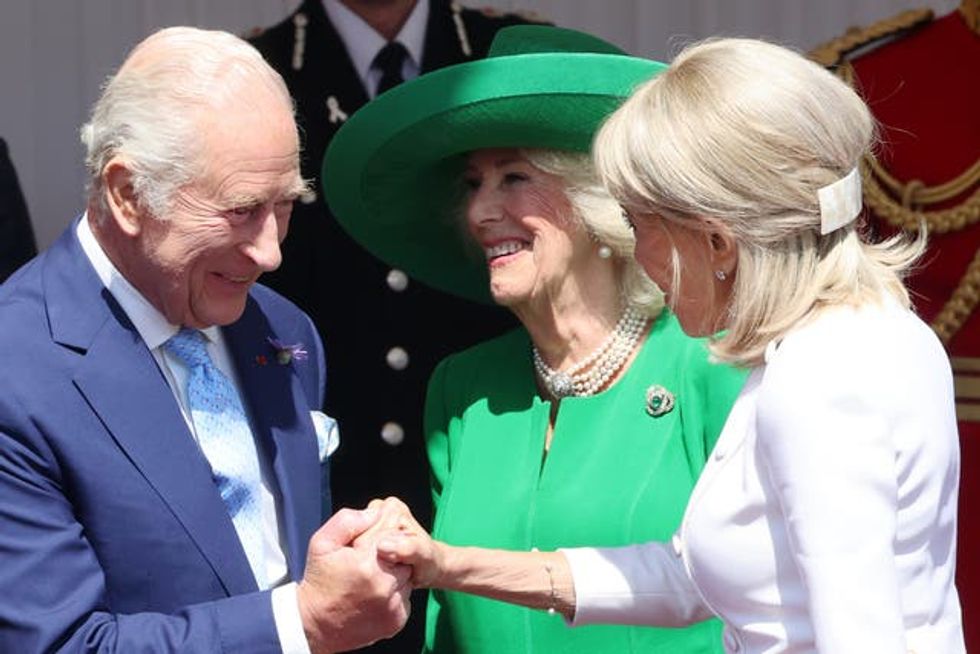 The King and Queen receive the France's First Lady Brigitte Macron during the state visit at Windsor l