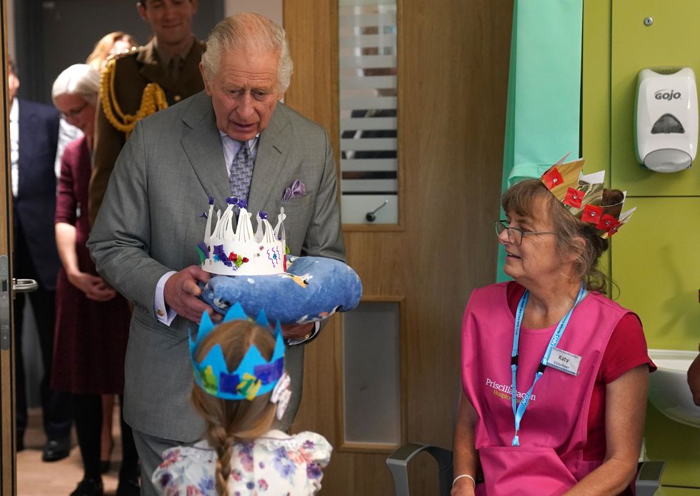 King presented with paper crown as he opens new hospice site