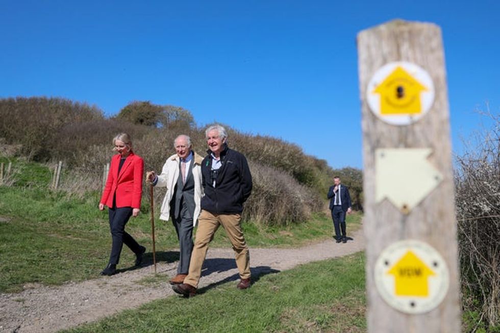The King, Environment Secretary Emma Reynolds and Natural England chairman Tony Juniper walk the King Charles III England Coast Path at Seven Sisters National Nature Reserve in Seaford