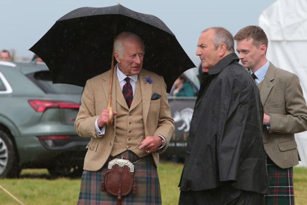 The King holding an umbrella at Mey Highland Games