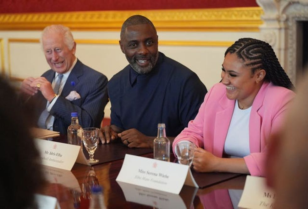 The King, Idris Elba and Serena Wiebe, of the Elba Hope Foundation, attending an event for The King\u2019s Trust to discuss youth opportunity at St James\u2019s Palace in central London