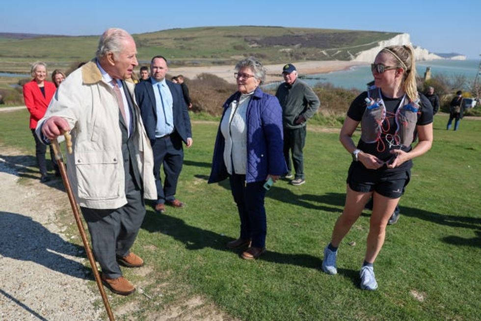 The King meets passers-by as he walks the King Charles III England Coast Path as he inaugurated the Seven Sisters National Nature Reserve in Seaford