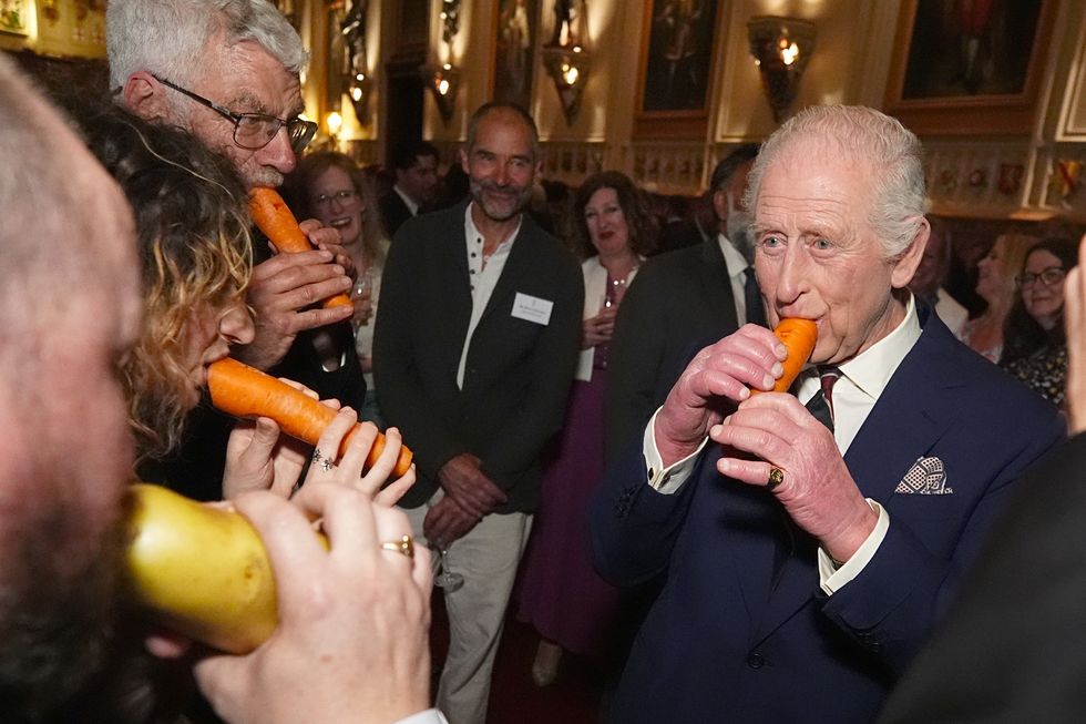 ‘Jolly’ King plays carrot recorder at Windsor Castle music reception