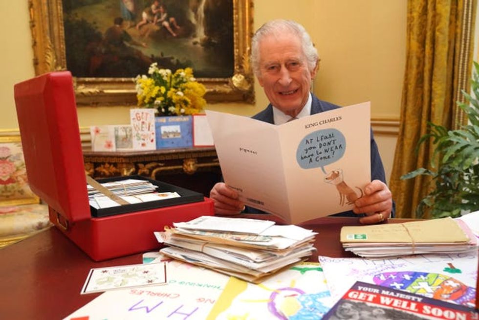 The King reading cards and messages sent by well-wishers in February 2024 following his diagnosis