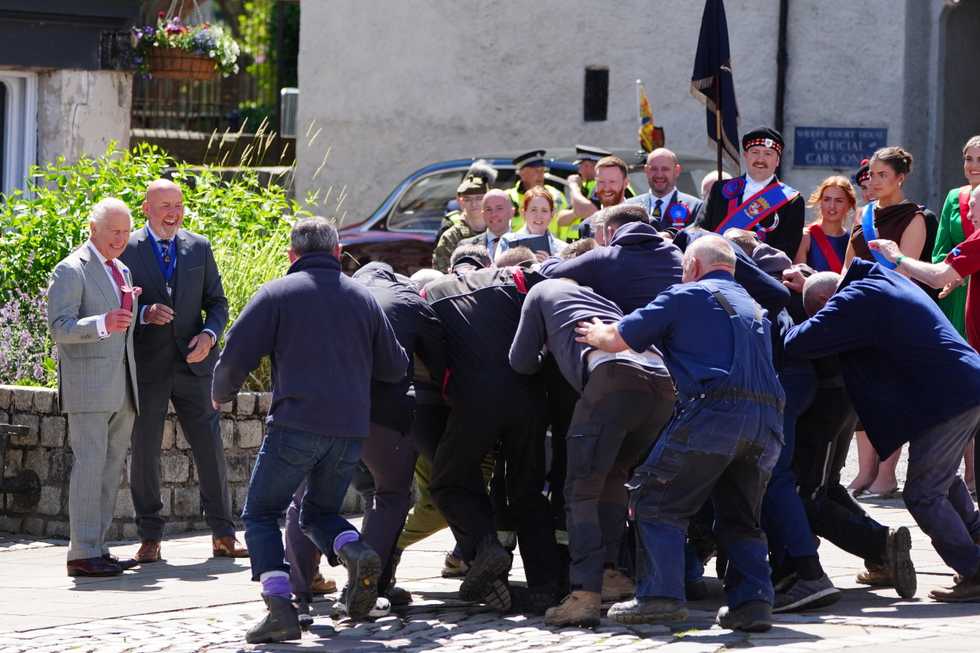 King starts ancient game in Jedburgh and steps back to watch scrum