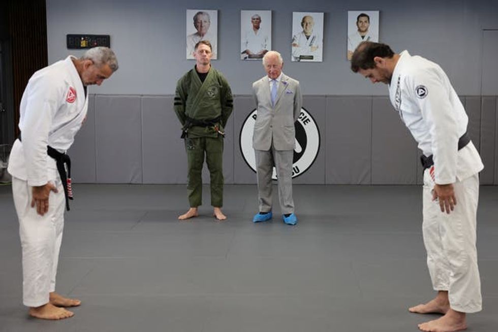 The King views a jiu jitsu demonstration