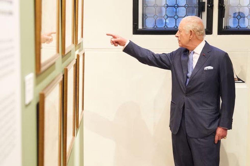 The King views the Queen Marie of Romania exhibition at the Garrison Chapel in London.
