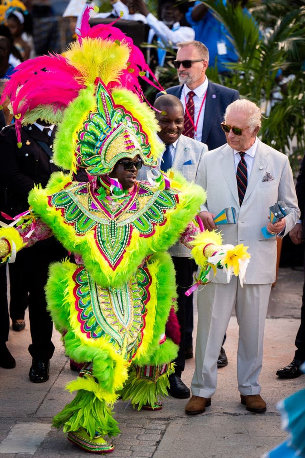 The King with a performer during the Junkanoo street parade