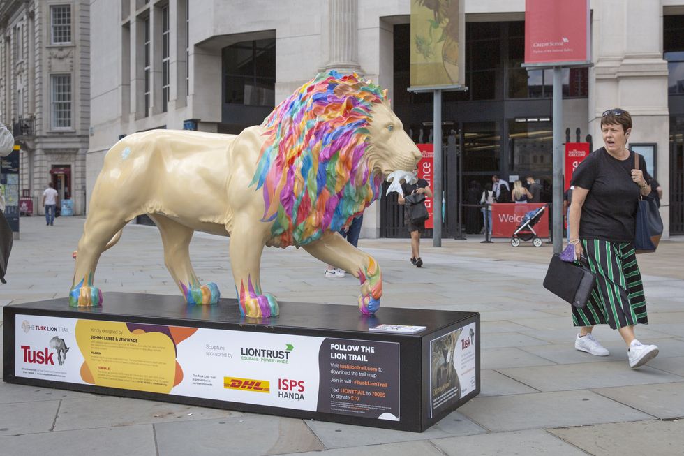 The lion statue designed by John Cleese and Jen Wade in Trafalgar Square, central London part of the Tusk Lion Trail which aims to raise awareness about threats to the animal\u2019s existence and conservation efforts to help the species (Joshua Bratt/PA)