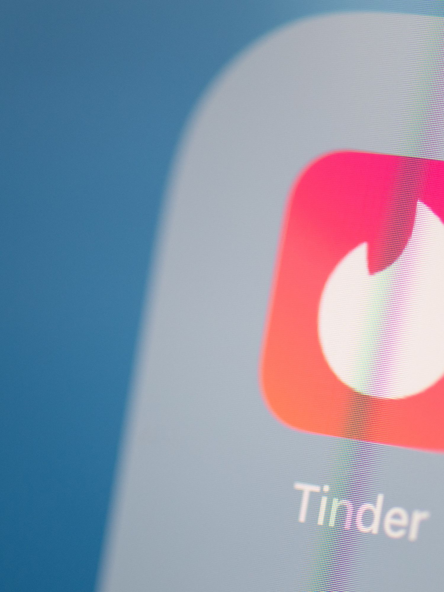 The logo of Tinder on the screen of an iPad.