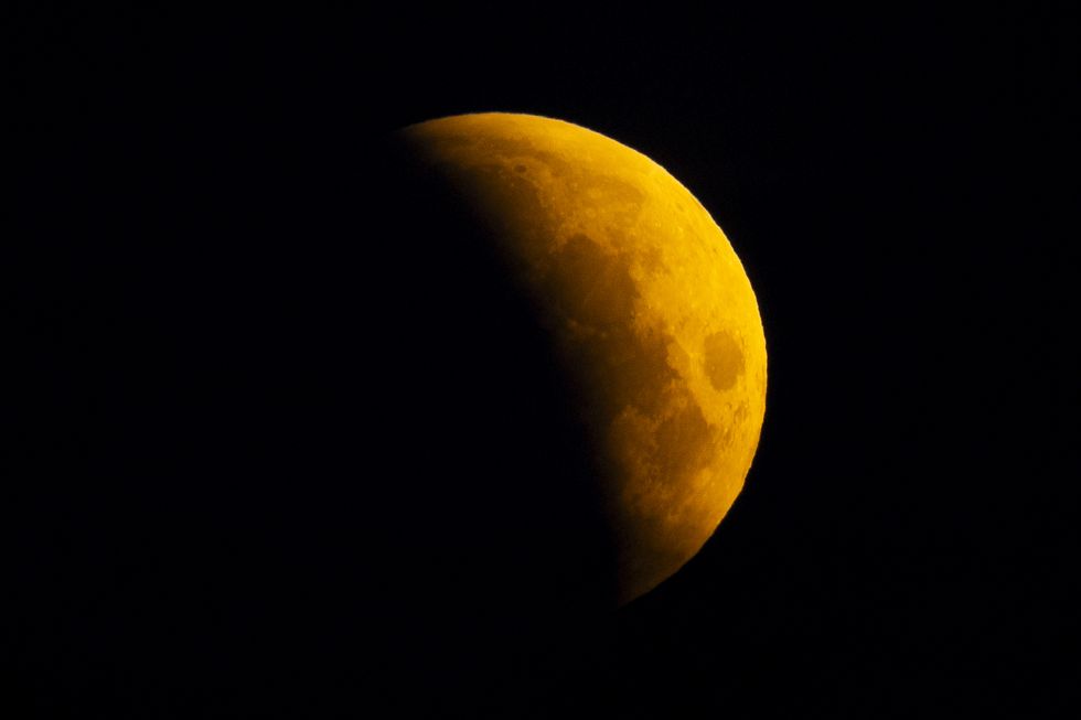 UK stargazers wake up to rare ‘blood moon’ partial lunar eclipse