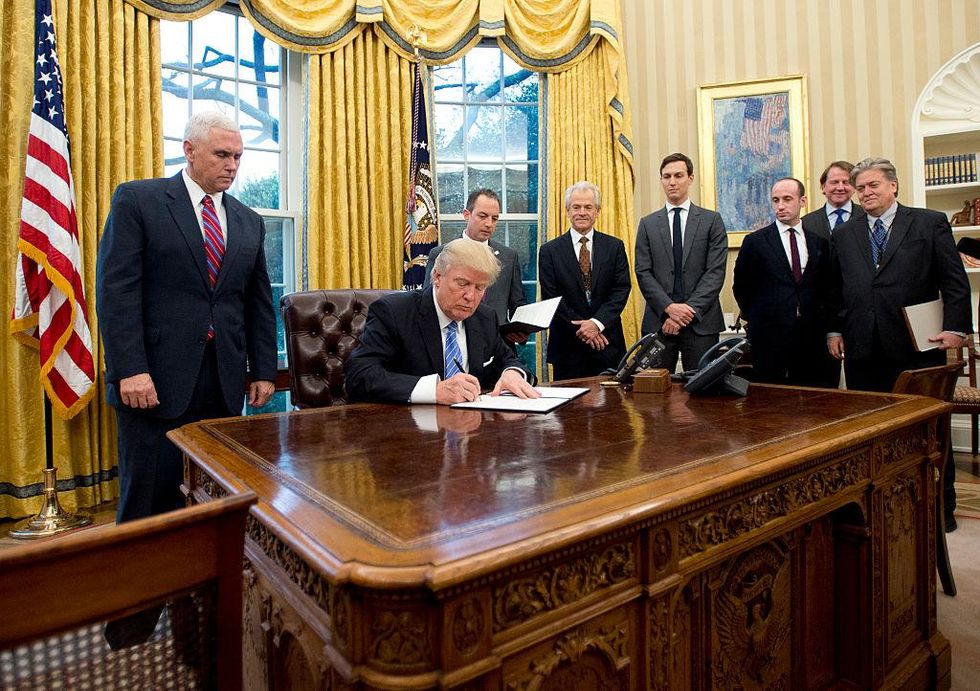 The men behind President Trump: US Vice President Mike Pence; White House Chief of Staff Reince Preibus; Peter Navarro, Director of the National Trade Council; Jared Kushner, Senior Advisor to the President; Steven Miller, Senior Advisor to the President; unknown; and Steve Bannon, White House Chief Strategist.