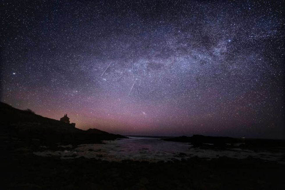 The Milky Way and Lyrid meteors falling through the sky