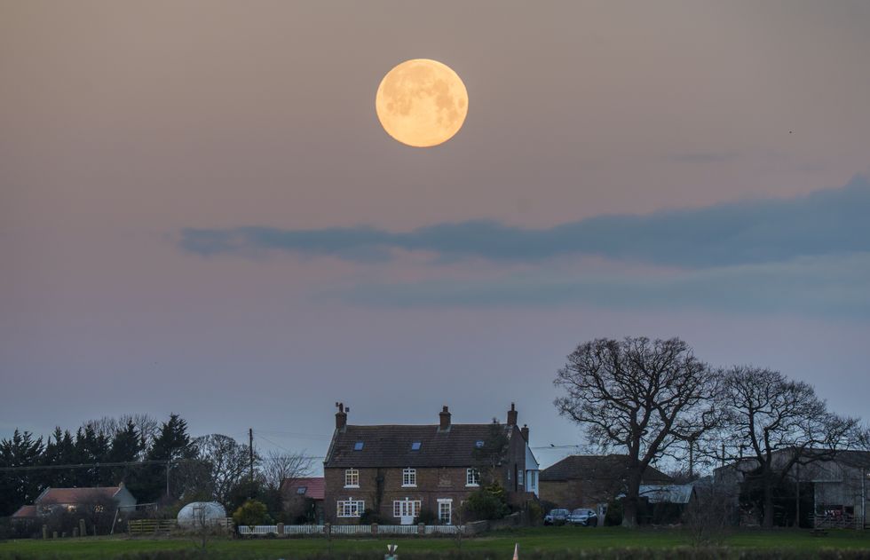Wolf supermoon appears in clear UK skies
