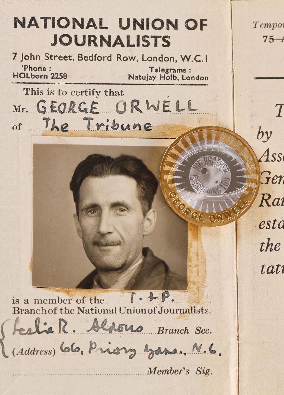 The new George Orwell \u00a32 coin on top of his NUJ ID card