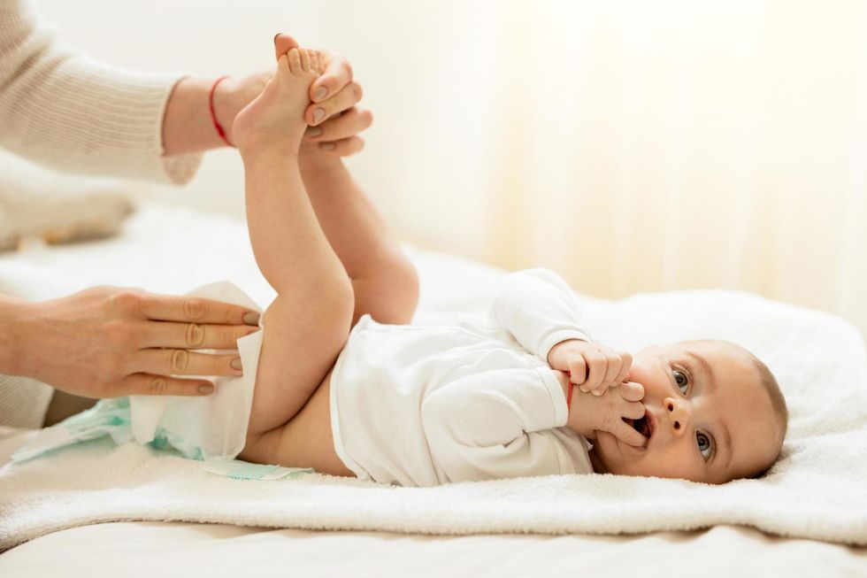 <p>The nursery said parents should wait until their babies have stopped playing before changing them</p>