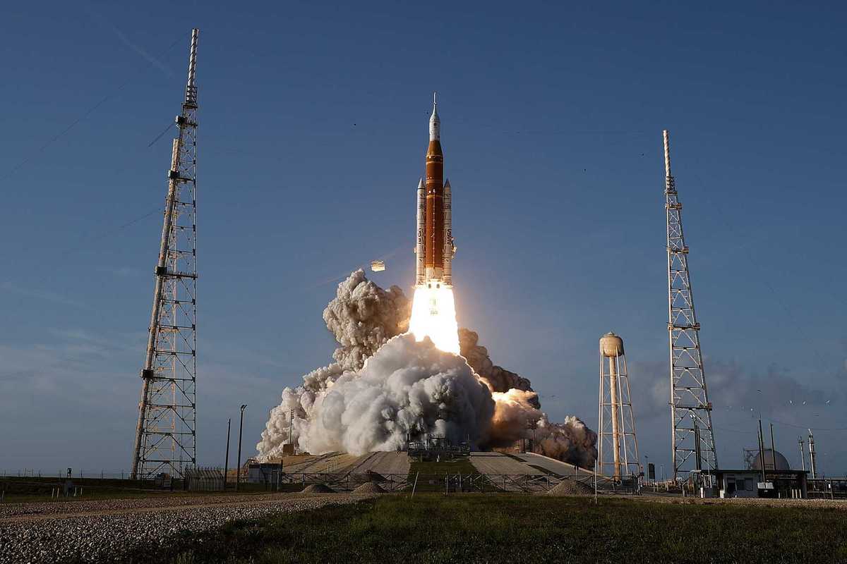 The Orion rocket launches with a cloud of smoke from the Kennedy Space Center, Florida.