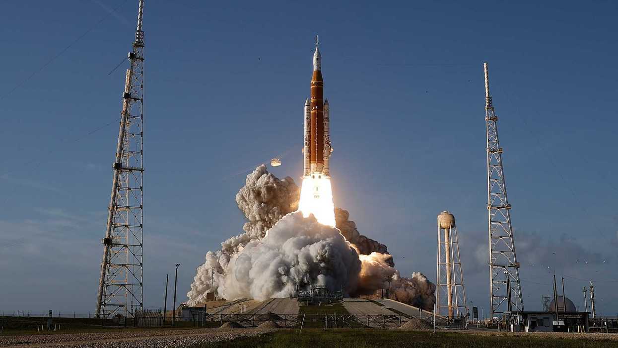 The Orion rocket launches with a cloud of smoke from the Kennedy Space Center, Florida.