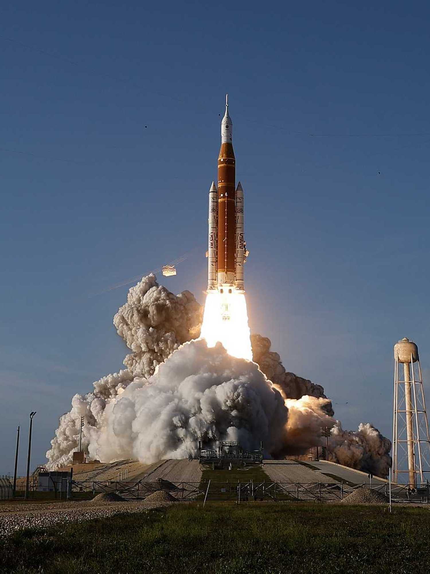 The Orion rocket launches with a cloud of smoke from the Kennedy Space Center, Florida.
