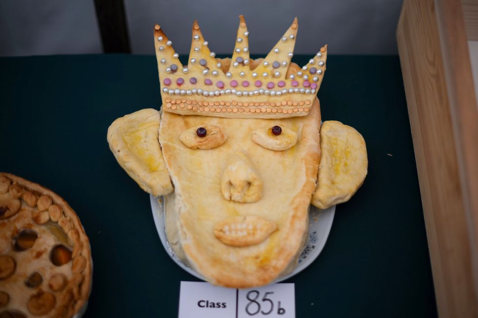 That looks very much like my husband, says Queen as King is depicted in pie form