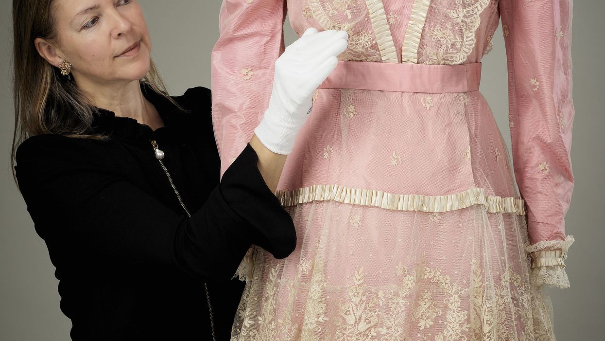 The pink satin dress with lace overlay worn by Princess Elizabeth to play Lady Christina Sherwood in Old Mother Red Riding Boots in 1944 (Royal Collection/PA)