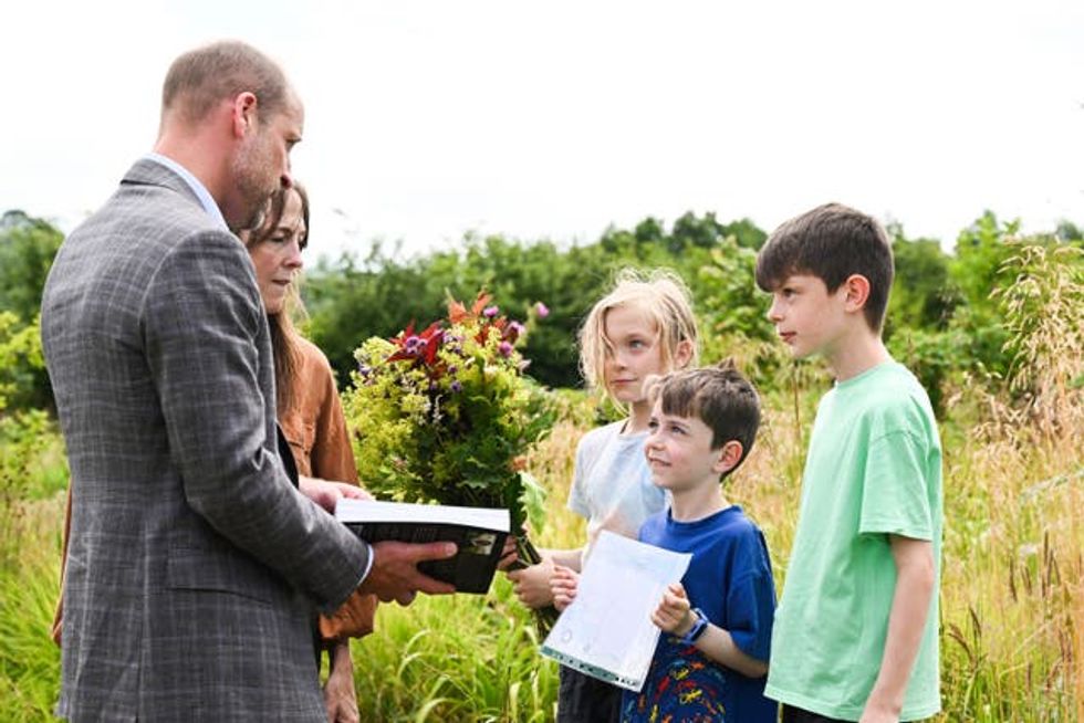 The prince meeting local school pupils during a visit to the Apricot Centre