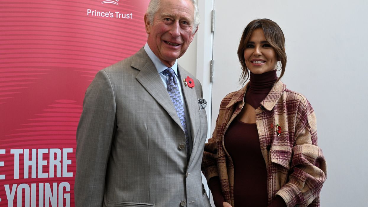 The Prince of Wales chats with Cheryl (Oli Scarff/PA)