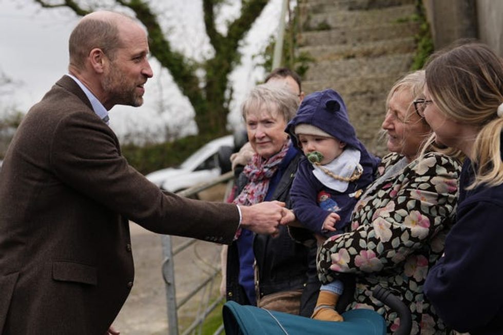 The Prince of Wales, known as the Duke of Cornwall while in Cornwall, meeting well-wishers during his visit to the Gear Farm Pasty Company, a family-run farm known for producing traditional Cornish pasties in St Martin, Helston, as he visits Cornwall for St Piran\u2019s Day