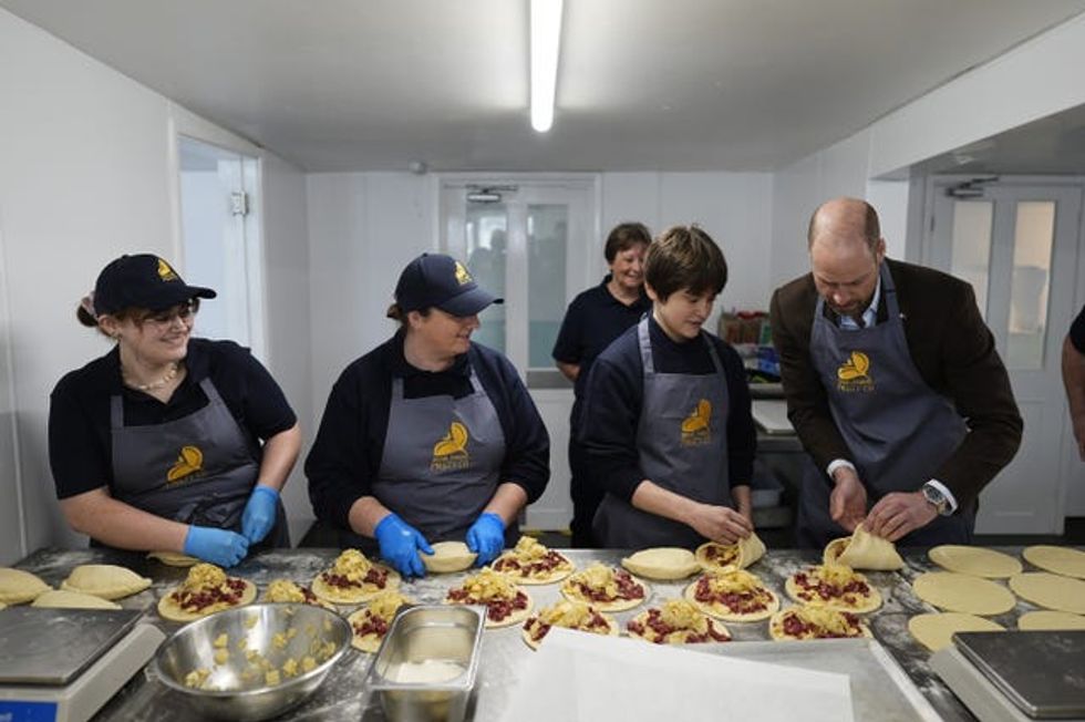 The Prince of Wales, known as the Duke of Cornwall while in Cornwall, tries his hand at crimping pasties during his visit to the Gear Farm Pasty Company, a family-run farm known for producing traditional Cornish pasties in St Martin, Helston, as he visits Cornwall for St Piran\u2019s Day