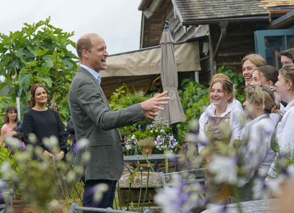 The Prince of Wales meets members of the kitchen team during a visit to the Duchy of Cornwall nursery, near Lostwithiel, Cornwall